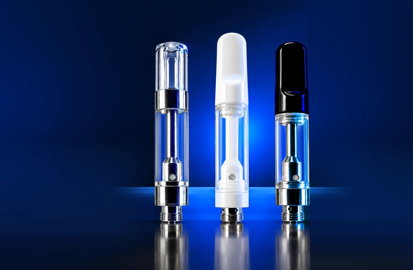 Empty 510 vape cartridges with clear glass, white ceramic, and black mouthpieces